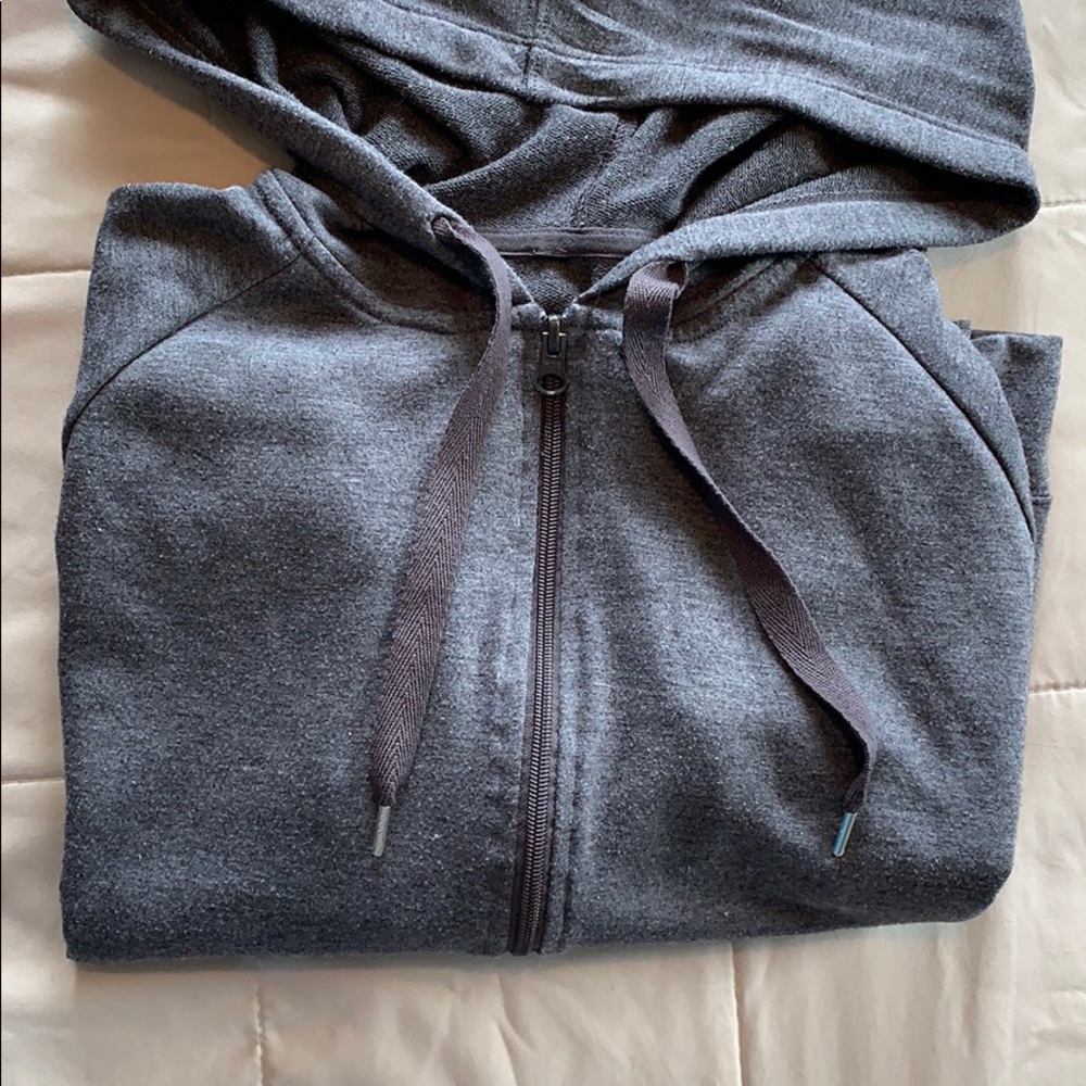 Loose fitting zip up hoodie.